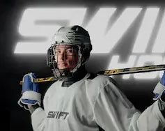 Person in hockey gear holding a stick with 'Swift Hockey' branding on a dark background